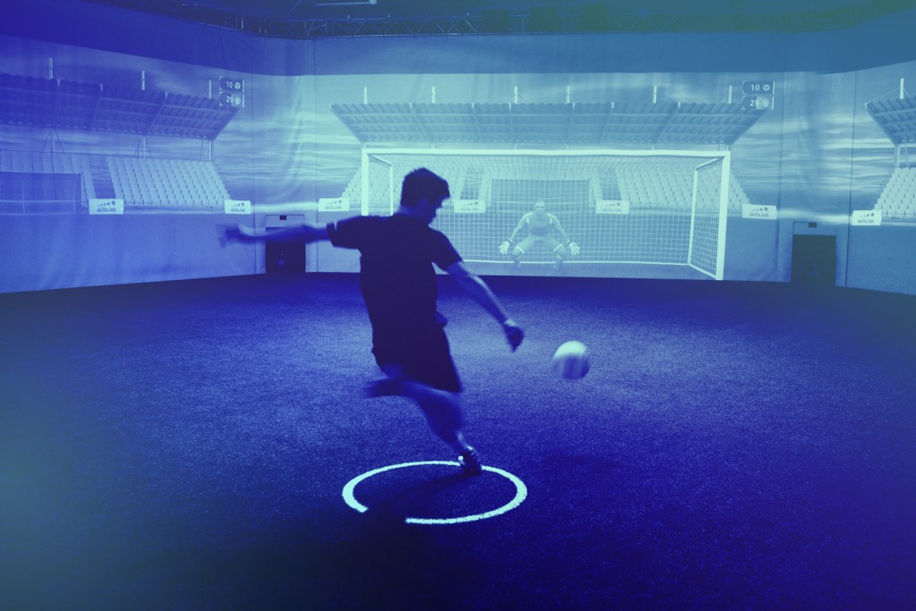 Image of an adult player shooting on the goal while training at skills.lab Arena