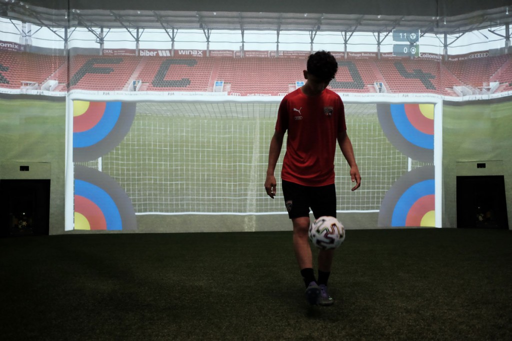 FC Ingolstadt - Image of a youth team player holding up a ball in the skills.lab Arena