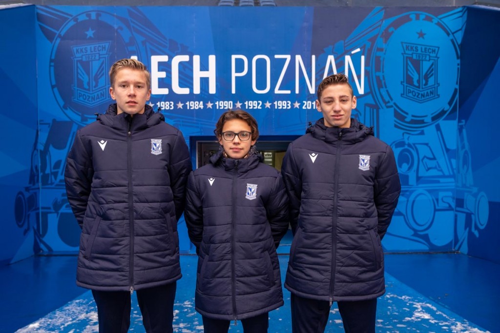 KKS Lech Poznań - Image of three academy players in the stadium of Lech Poznan