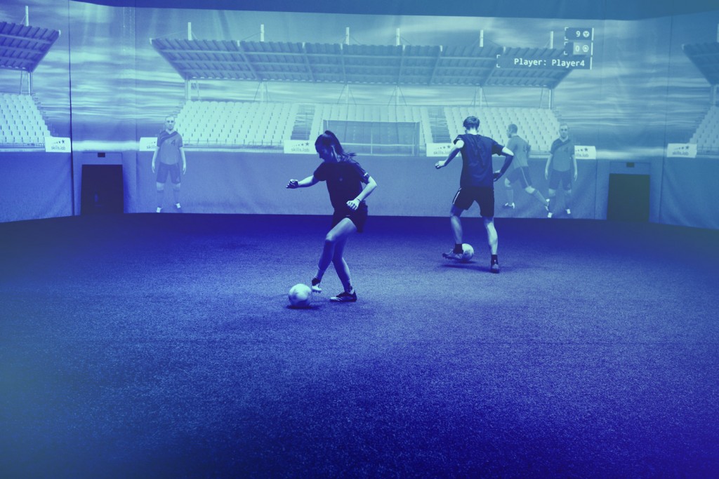 Image showing two adult players at skills.lab Arena in a parallel passing exercise